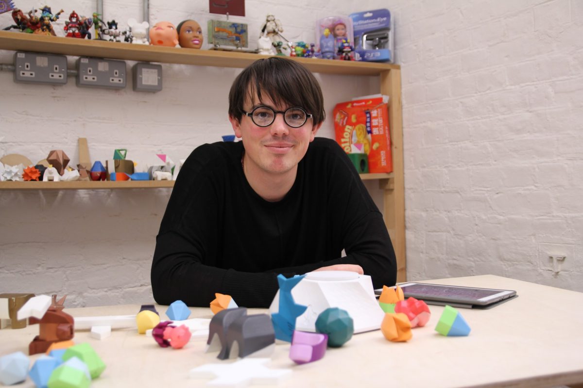 George from the Beasts of Balance team with a plinth and stackable objects